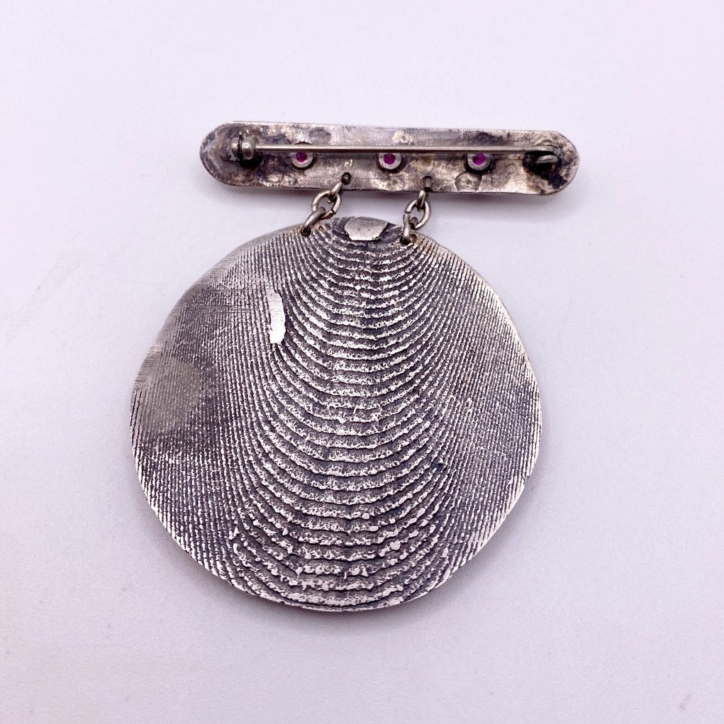 Vintage Metal Metal Anagram Design With Three Median Rubies 2” Round