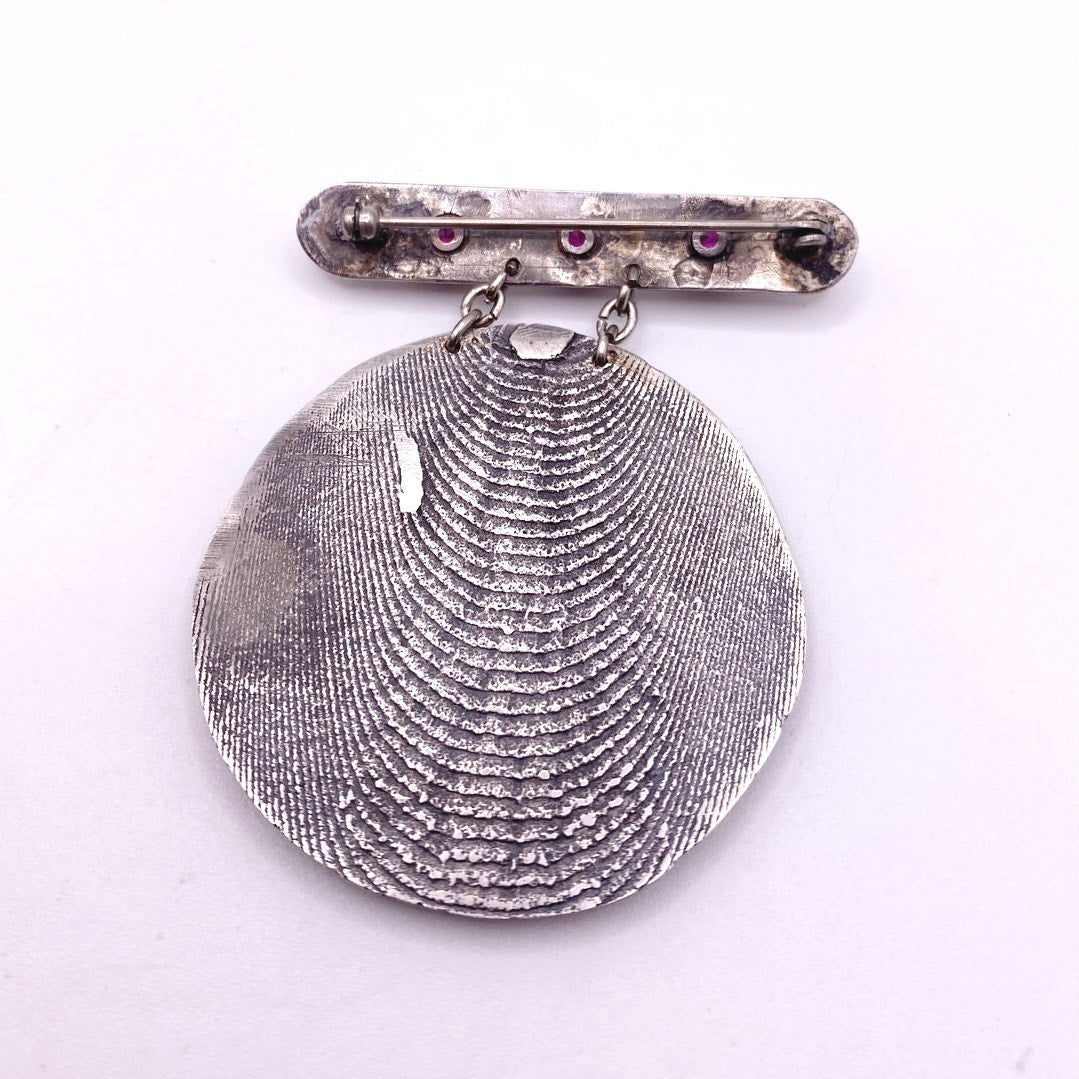 Vintage Metal Metal Anagram Design With Three Median Rubies 2” Round