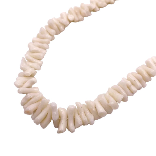 Necklace made of white shell beads on a white background