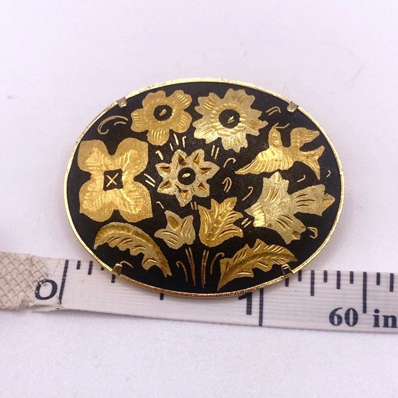 Vintage Damascene Brooch featuring Floral Motifs