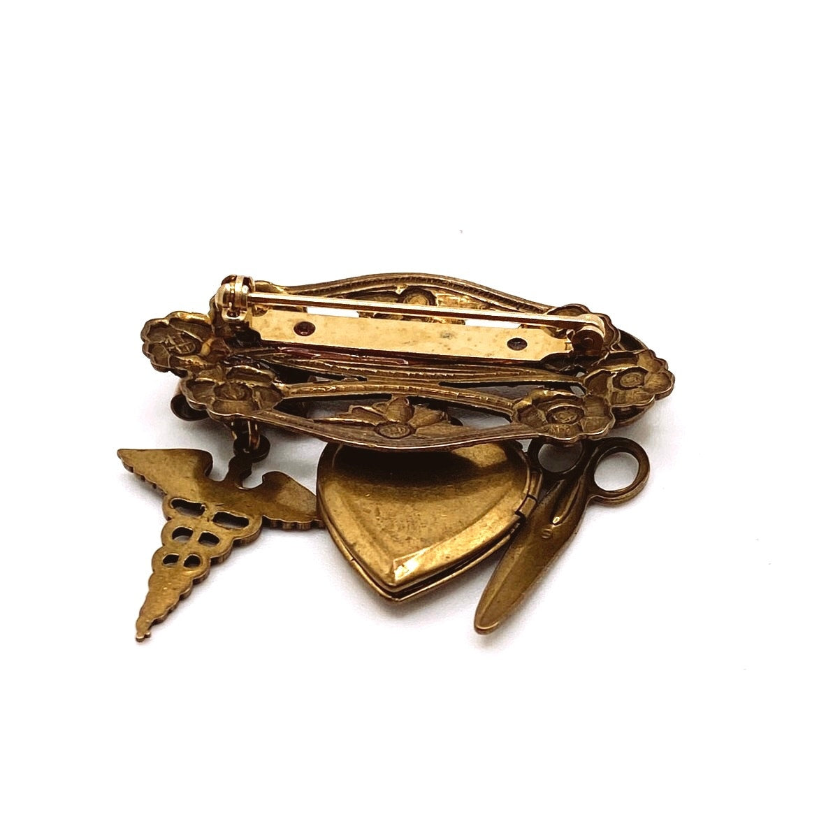 Vntg Pin Filigree Charms Of Health Caduceus Symbol Scissors and Heart Locket